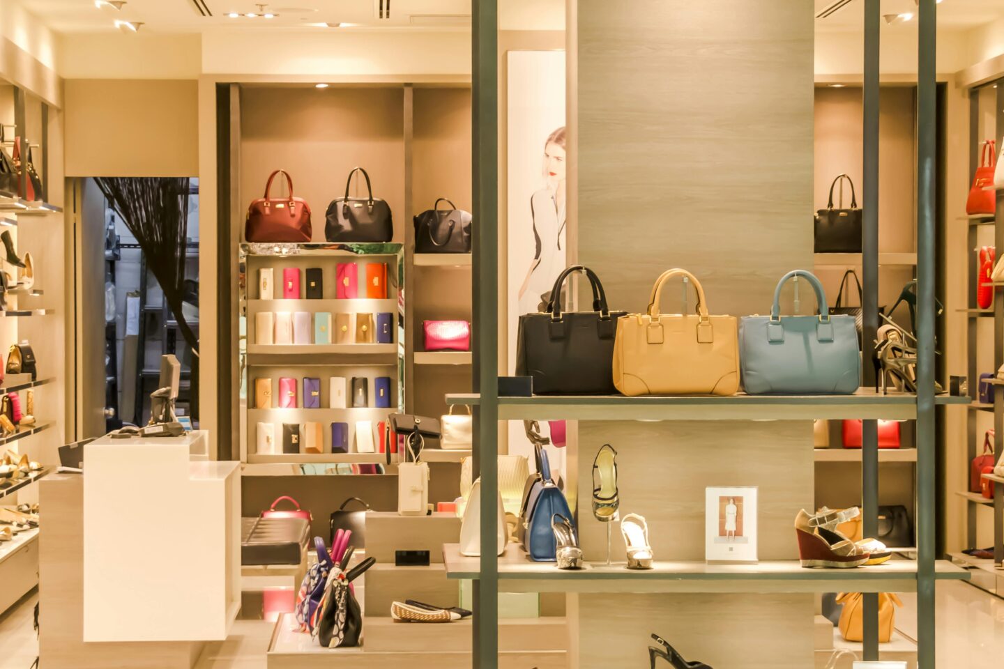 A well-organized luxury retail store with an elegant display of handbags and shoes, reflecting the premium offerings of Massimo Dutti’s collection, where timeless design meets modern sophistication.