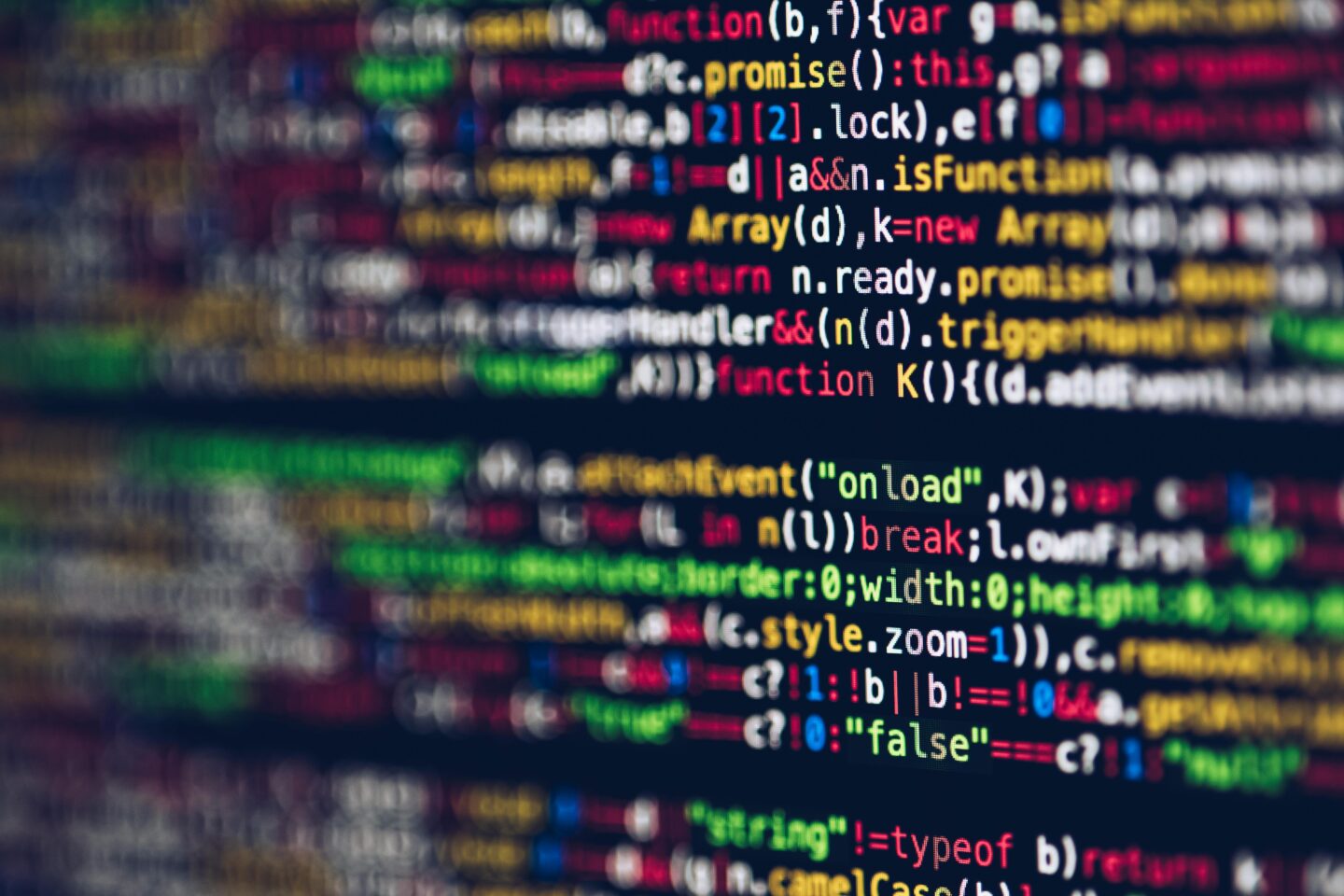 Blurred code on a monitor displaying vibrant lines of programming, representing the advanced web development tools and secure hosting services provided by Nazwa.